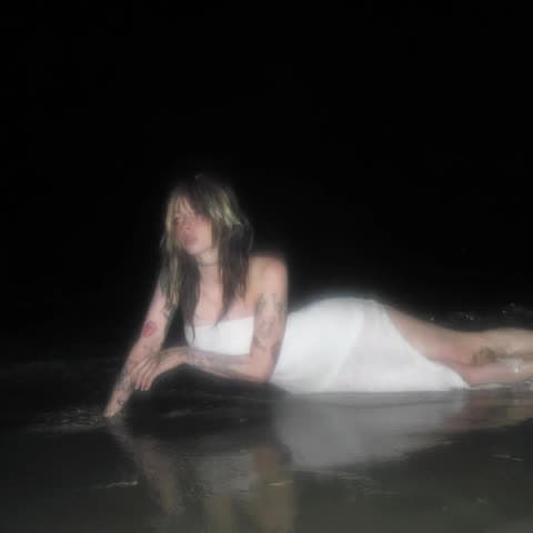 Noemiexlili Tattooed Body Lying Beach OnlyFans Photo Leaked